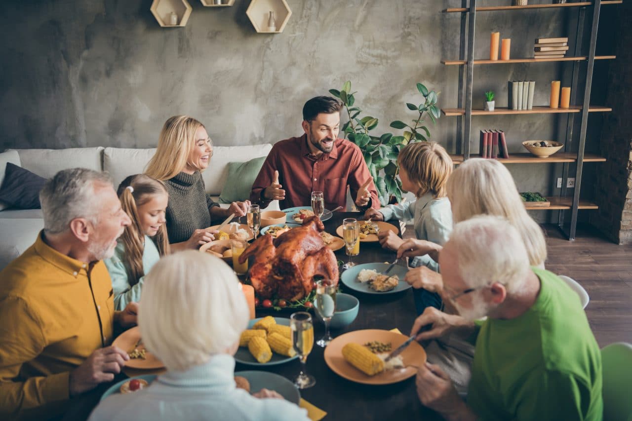 Family having a large holiday dinner celebration.