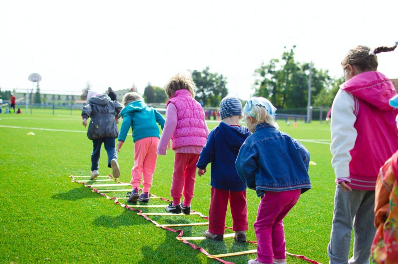 A group of children playing together outside.