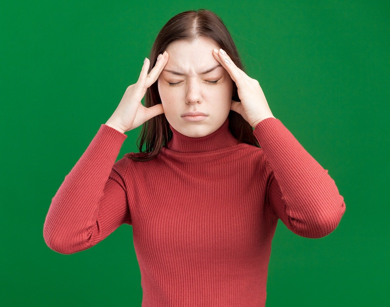 woman holding head