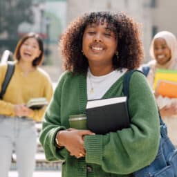 Smiling teenagers on their first day at college.